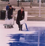 Halloran, pouring paint onto his ice canvas